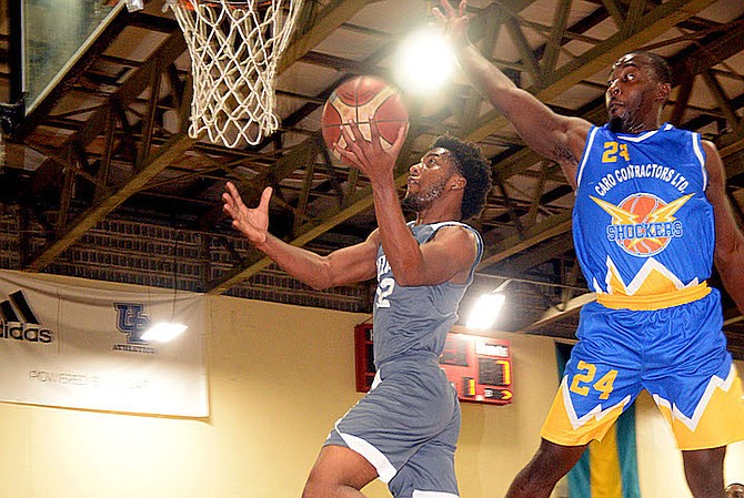 UNIVERSITY of The Bahamas Mingoes guard Delano Armbrister goes to the basket for a layup as Caro Construction Shockers guard Horris McKenzie tries to block him in the first game of their best-of-three NPBA division one playoff series. 
Photo: UB ATHLETICS