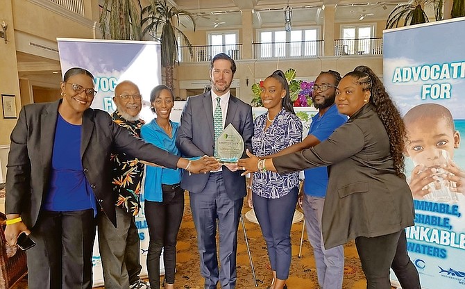 The Bahamas Protective Areas Fund presented the Grantee Excellence Award to Waterkeepers Bahamas on Friday. From left to are Karen Panton, executive director of BPAF; Joseph Darville, chairman of Waterkeepers Bahamas; Andurah Daxon, Waterkeepers Bahamas; Rupert Hayward, vice chair of BPAF; Rashema Ingraham, executive director of Waterkeepers Bahamas; Javon Hunt and Liyah Forbes, of Waterkeepers Bahamas. Photo: Taylor Ferguson, Waterkeepers Bahamas.