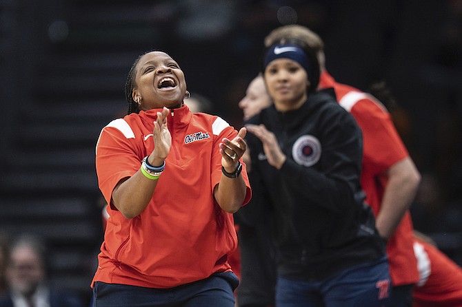 Mississippi coach Yolett McPhee-McCuin applauds during the first half of the team's Sweet 16 college basketball game against Louisville in the women's NCAA tournament Friday, March 24, 2023, in Seattle. (AP Photo/Stephen Brashear)