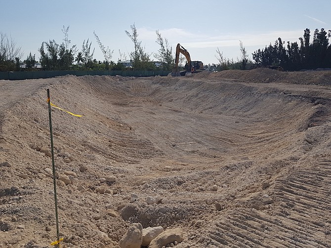 WORK begins on the removal of sand to construct the Fortune Bay Canal.