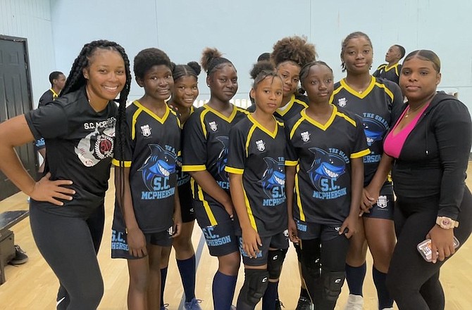 HEAD coach Da’Nai Minus, far left, celebrates with the SC McPherson Sharks junior girls’ team after their playoff win against the AF Adderley Tigers. Photo: Tenajh Sweeting