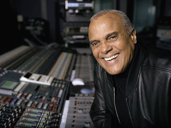 Actor and singer Harry Belafonte poses for a portrait at a New York recording studio, Nov. 1, 2001. Belafonte died Tuesday of congestive heart failure at his New York home. He was 96. (AP Photo/Leslie Hassler, File)