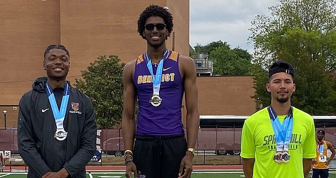 JUMPING FOR GOLD: Ras Jesse Delancy on top of the medal dais for his high jump gold on Saturday at the SIAC Track & Field Championships at Morehouse College in Atlanta, Georgia.