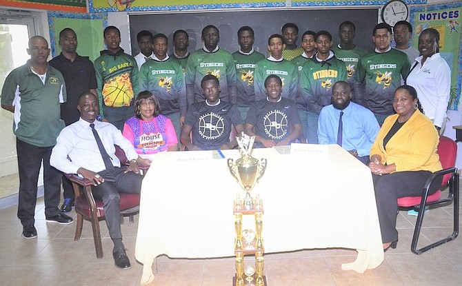 SUNLAND Stingers senior boys basketball team flank Donell Basden and Jordan Saunders as they sign their letters of intent to attend Butte College.