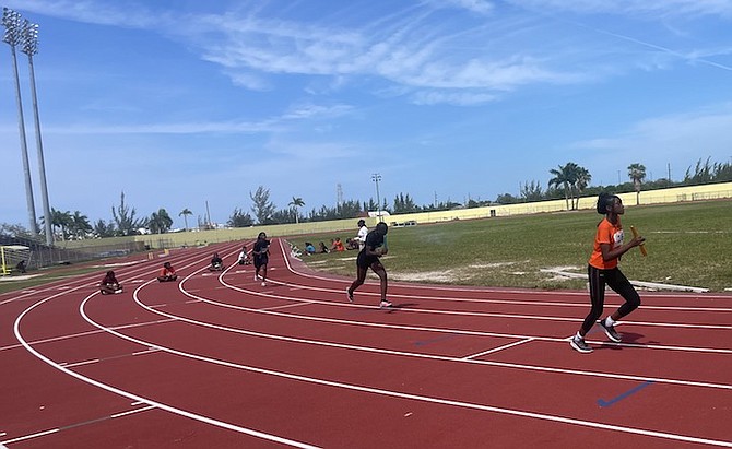 ON THE FAST TRACK: Primary and high school students compete in the Bahamas Scholastic Athletic Association’s two-day track and field meet at the original Thomas A Robinson stadium yesterday. 
Photo: Tenajh Sweeting