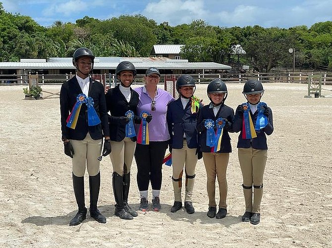 FIRST PLACE CEC Blue Marlins, shown from left to right, Connor Watkins, Hannah D’Aguilar, Trainer Kimberly Johnson, Kaitlyn Russell, Marlo Pinder and Kelsey Pyfrom.