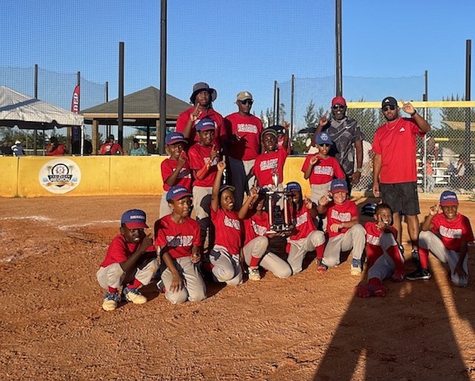 HEART OF A CHAMPION: Reloaded Team B claims championship hardware for the Coach Pitch division at yesterday’s team championship game at the Baillou Hills Sporting Complex.
Photos by Tenajh Sweeting