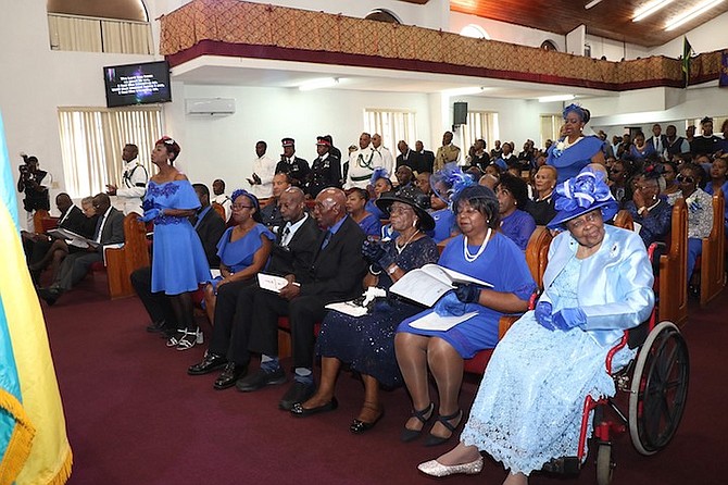 Ray Minus Jr family members mourn during his funeral service.  
Photos by Latisha Henderson