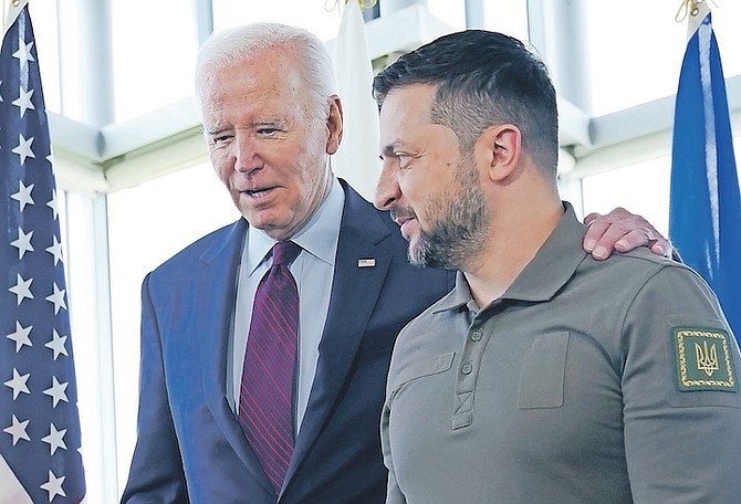 President Joe Biden, left, walks with Ukrainian President Volodymyr Zelenskyy ahead of a working session on Ukraine during the G7 Summit in Hiroshima, Japan, on Sunday. 
Photo: Susan Walsh/AP