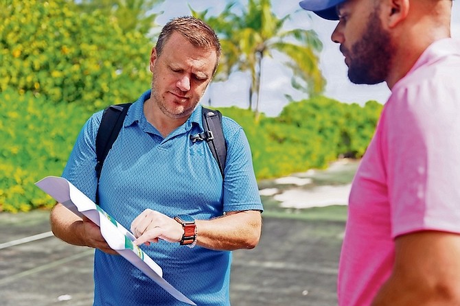 RCI’s chief product and innovation officer, Jay Schneider, looking over a plan of the western beach on Paradise Island. Photos: Austin Fernander