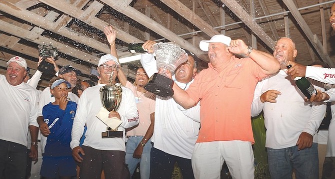 CLASS A winners ‘New Legend’ celebrate their victory during the 54th annual Long Island Regatta closing ceremony in Salt Pond, Long Island, on Saturday.