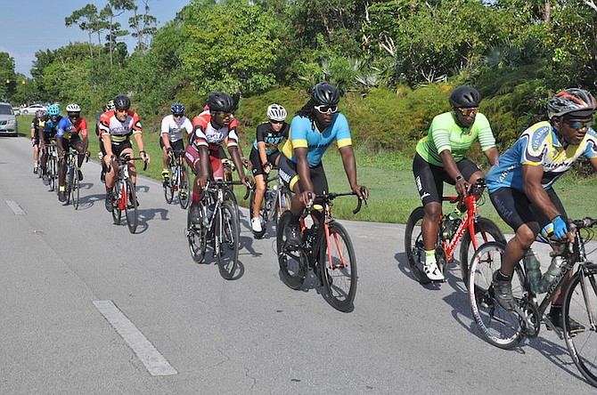 Cyclists in action during the 50th Independence National Road Cycling Championships in Grand Bahama despite the inclement weather.