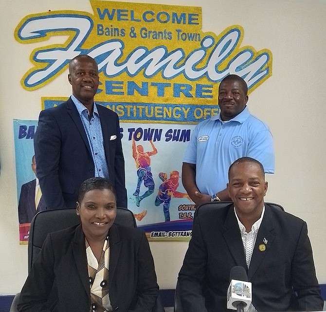 Golden Girl Pauline Davis and MP Wayde Watson seated in front of the organisers Sean Bastian and Mark Knowles.