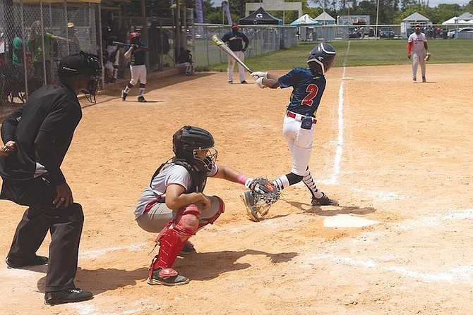 YOUNG baseball players in action over the weekend at Bahamas Baseball Association’s G-Ball National Baseball Championships.        
Photo: Moises Amisial/Tribune Staff