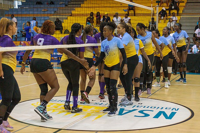 SPORTSMANLIKE CONDUCT: Women of Columbus Isles Arawaks and Abaco Survivors show a strong display of unity and camaraderie during the Bahamas Golden Jubilee Games last night.       
Photos: Austin Fernander/Tribune Staff