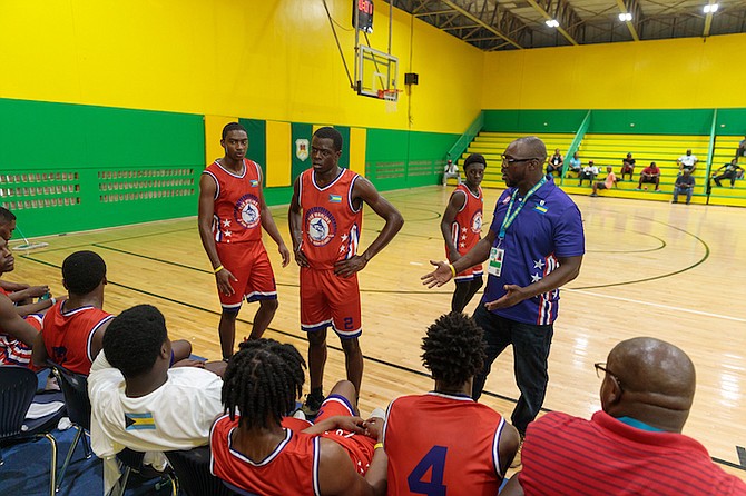 IN THE HUDDLE: The Bimini and Berry Islands Marlins dropped the Andros Chickcharnies 47-38 at the DW Davis Gymnasium yesterday during the 6th Bahamas Games.           
Photo: Austin Fernander/Tribune Staff