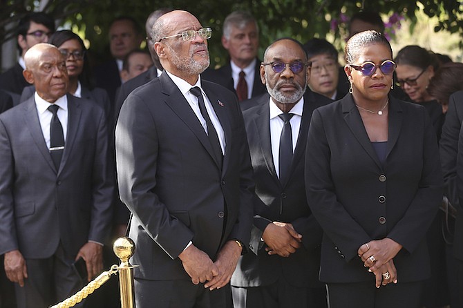 HAITIAN Prime Minister Ariel Henry, front left, and Culture and Communications Minister Emmelie Prophete Milce, front right, attend a ceremony in memory of slain Haitian President Jovenel Moise, two years after his killing, at the National Pantheon Museum in Port-au-Prince, Haiti, Friday, July 7, 2023.
Photo: Odelyn Joseph/AP