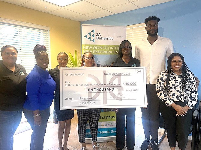 NBA STAR Deandre Ayton, a centre for the Phoenix Suns, can be seen on Monday as he donated $10,000 to the Junior Achievement Bahamas programme.
