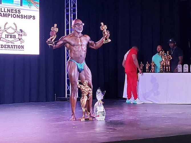 Veteran Godfrey Robinson wins multiple trophies at the Bahamas Bodybuilding Wellness and Fitness Federation National Championships over the weekend.