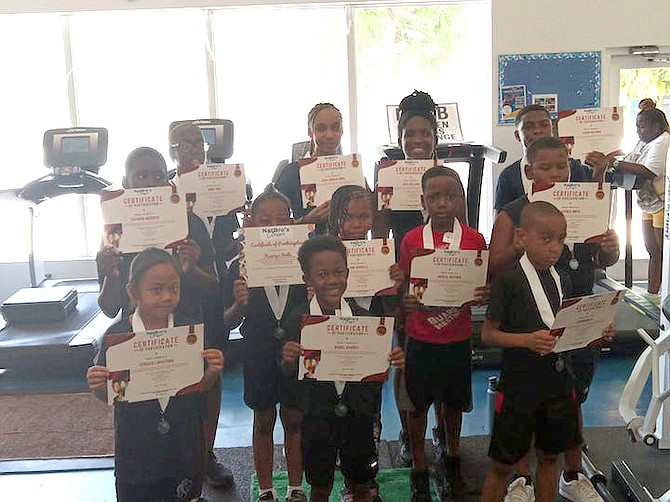 PARTICIPANTS with their certificates at the Bahamas Bodybuilding Wellness and Fitness Federation’s inaugural youth bodybuilding championship at the University of the Bahamas on Saturday.