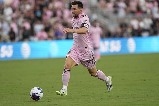 Inter Miami forward Lionel Messi (10) runs with the ball during the first half of a Leagues Cup soccer match against Atlanta United, Tuesday, July 25, 2023, in Fort Lauderdale, Fla. (AP Photo/Lynne Sladky)