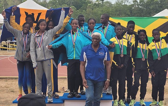 NACAC president Mike Sands is shown after presenting gold medals to the Bahamas team at the IV North American, Central American and Caribbean Under-13 and Under-15 Championships in the Dominican Republic recently.