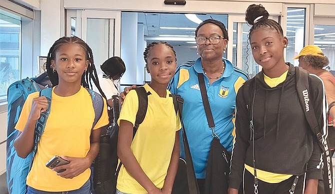 COACH Paula Whitfield with the girls’ under-12 tennis team of Danielle Saunders, Caitlyn Pratt and Marina Bostwick. They are representing The Bahamas in the ITF/ COTECC U-12 Sub Region 3 competition in in Santo Domingo, Dominican Republic.