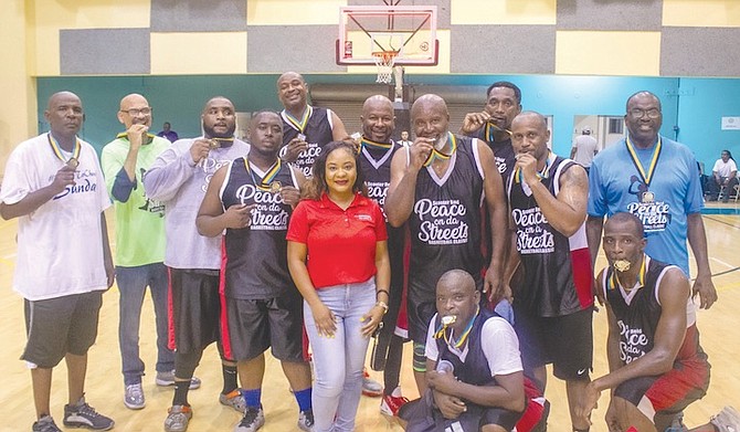 The Pastors celebrating their victory over the Politicians as the curtains came down on the annual Peace on da Street Basketball Tournament at the Kendal Isaacs Gymnasium.
Photo: Dominique Fernander