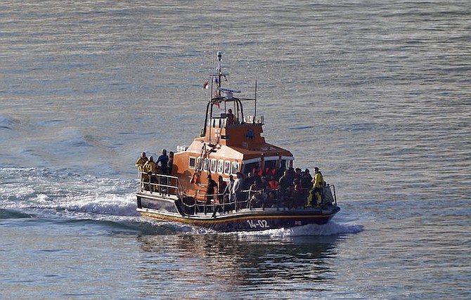 A group of people thought to be migrants are brought in to Dover, Kent, onboard the Ramsgate Lifeboat following a small boat incident in the Channel, Thursday August 10, 2023. 
Photo: Gareth Fuller/AP