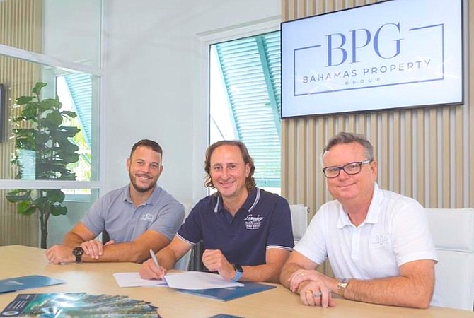 WILLIAM Pizzorni of Legendary Marina Resort (centre) with Bahamas Property Group agent Patrick Ryan Knowles (left), and Bahamas Property Group’s senior managing partner, Richard Sawyer, at a sales and marketing partnership signing ceremony at the realtor’s head office in Nassau.