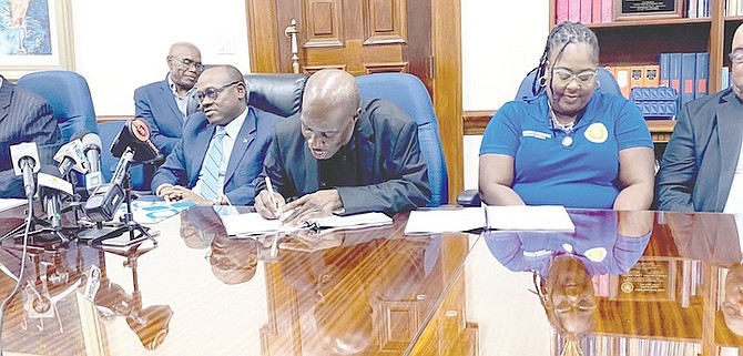 THE Bahamas Air Navigation Services Authority and the Bahamas Air Traffic Controllers Union signed a $1.8m three-year industrial agreement yesterday.
Photo: Lynaire Munnings