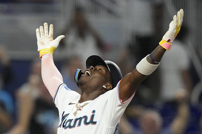 Miami Marlins’ Jasrado “Jazz” Chisholm Jr celebrates as he crosses home plate after hitting a grand slam during the third inning against the Atlanta Braves yesterday in Miami.      
(AP Photo/Lynne Sladky)