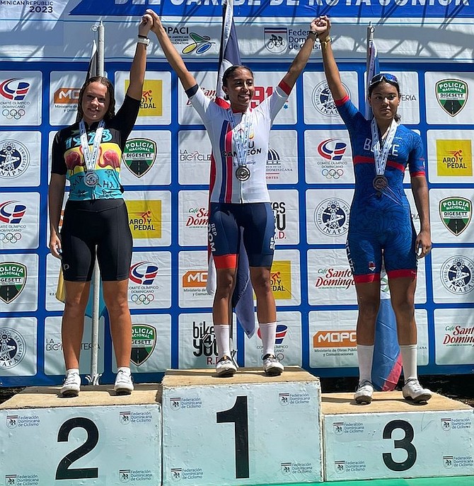 SHOWN on the podium are The Bahamas’ Kami Roach, far left, with her silver medal won in the road race.