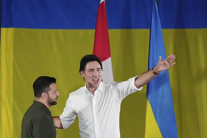 Prime Minister Justin Trudeau, right, introduces Ukrainian President Volodymyr Zelenskyy during a rally at the Fort York Armoury in Toronto on Friday, Sept. 22, 2023. 
Photo: Chris Young/The Canadian Press/AP