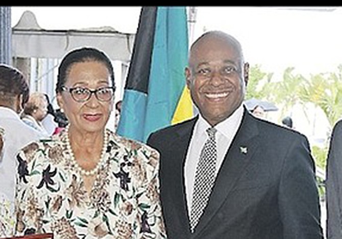 GOVERNOR General Dame Marguerite Pindling standing next to then Tourism Minister Obie Wilchcombe
during an award presentation in 2016.
Photos: BIS