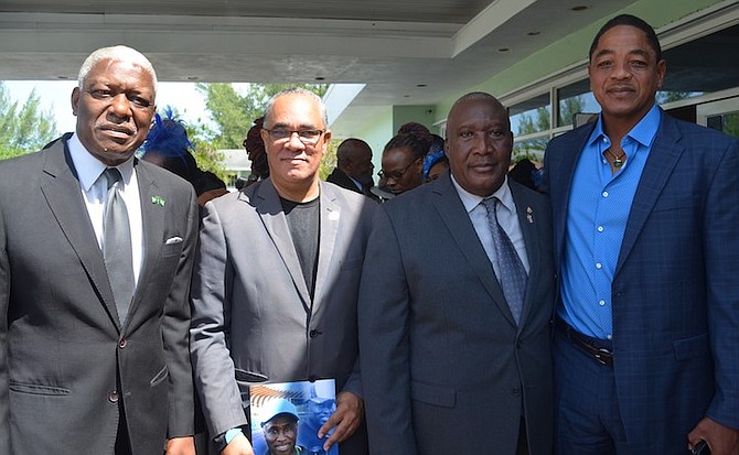 Shown, from left to right, are track and field officials, NACAC president Mike Sands, technician Rev Trevor Moss and coaches Rupert Gardiner and Shaun Miller Sr.