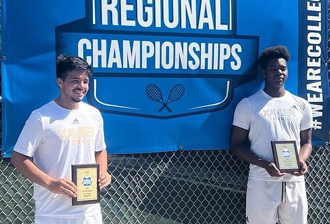 DOUBLES CHAMPIONS: Jacobi Bain, right, of The Bahamas, and his partner Nereo Suarez display their awards after winning the men’s doubles title at NAIA Gulf Regional Championships at the XULA Tennis Centre.