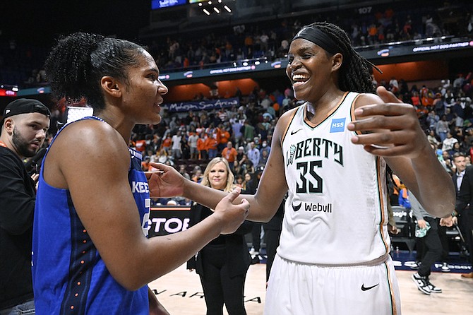 New York Liberty forward Jonquel Jones (35) meets with former teammate Connecticut Sun forward Alyssa Thomas (25) at the end of Game 4 of their WNBA basketball semifinal playoff series, on Sunday, October 1 in Uncasville, Connecticut.