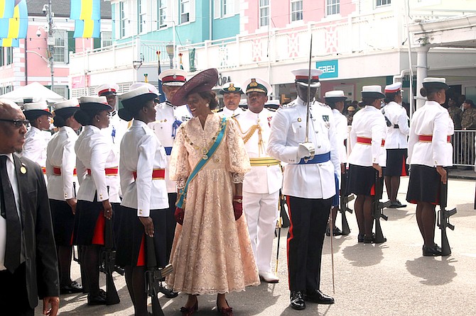 GOVERNOR General Cynthia ‘Mother’ Pratt inspects the police during the ceremony before her speech to open Parliament.