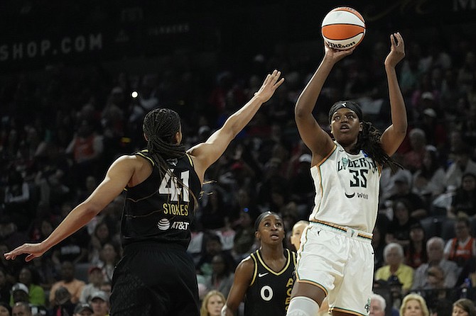 Liberty forward Jonquel Jones shoots over Aces centre Kiah Stokes during the first half in Game 1 of a WNBA basketball final playoff series on Sunday in Las Vegas. 
(AP Photos/John Locher)