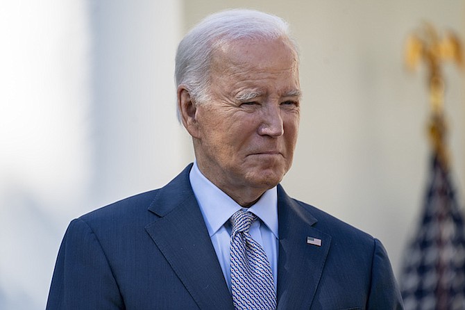 PRESIDENT Joe Biden listens as he is introduced to deliver remarks in the Rose Garden of the White House yesterday.
Photo: Evan Vucci/AP