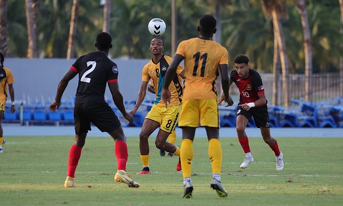 ALL IN PLAY: Christopher Rahming, midfielder of the Junkanoo Boyz, tries to make a play
in game one of the October window in the Concacaf Nations League soccer match on Saturday.
Photos: Dante Carrer