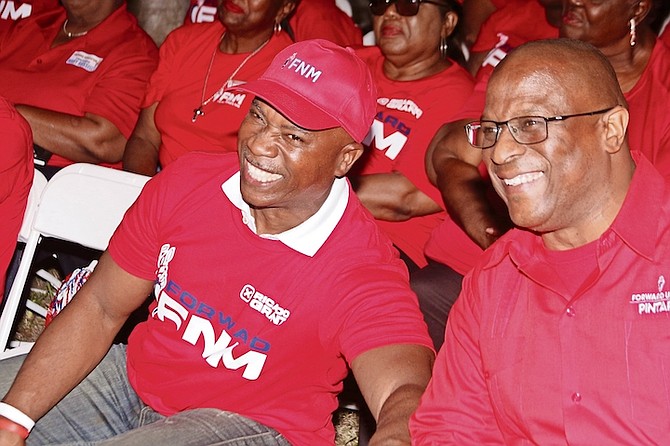 NEWLY confirmed FNM candidate for West Grand Bahama and Bimini Ricardo Grant sits next to FNM leader Michael Pintard during a rally in Eight Mile Rock, Grand Bahama on Saturday.
Photos: Vandyke Hepburn