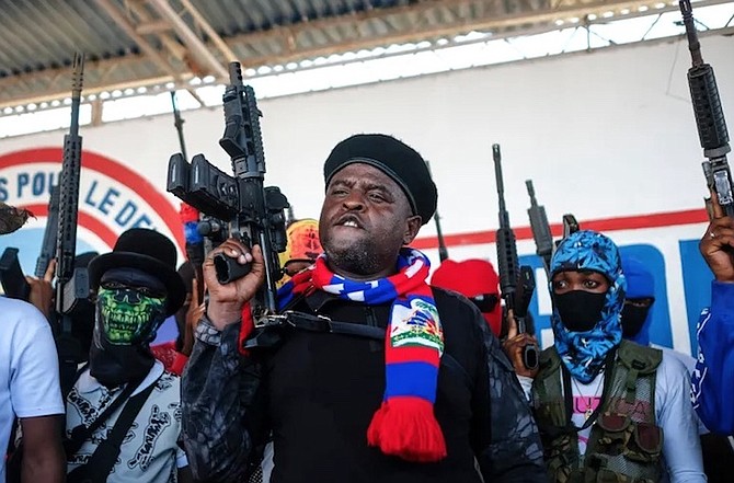 LEADER of the “G9 and Family” gang, Jimmy Cherizier, better known as Barbecue, shouts slogans with his gang members after giving a speech, as he leads a march against kidnappings, through the La
Saline neighbourhood in Port-au-Prince, Haiti, on October 22, 2021.
Photo: Matias Delacroix/AP