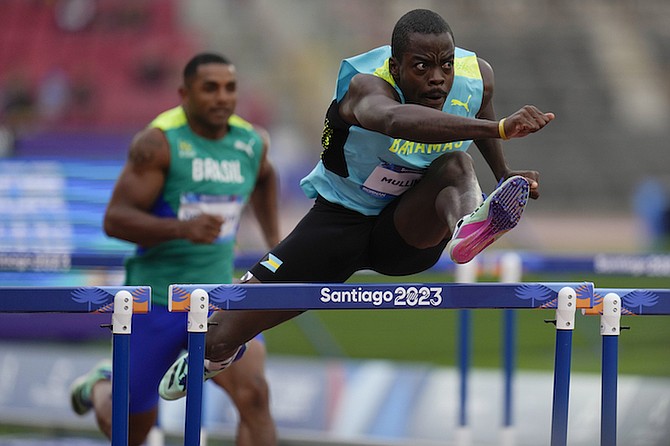 Ken Mullings, of The Bahamas, competes in a men’s decathlon 110-metre hurdles heat at the Pan American Games in Santiago, Chile, on Tuesday, October 31, 2023.            
(AP Photo/Fernando Vergara)