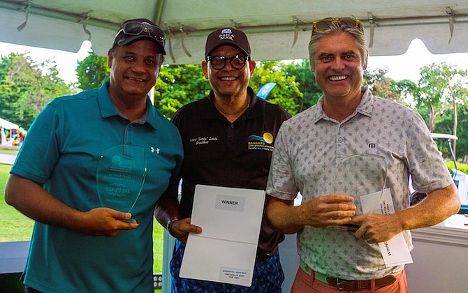 SHOWN, from left to right, are first place winner Tony Aranha, Robert “Sandy” Sands, President of The Bahamas Hotel and Tourism Association (BHTA) and First Place Winner Neale Jones.