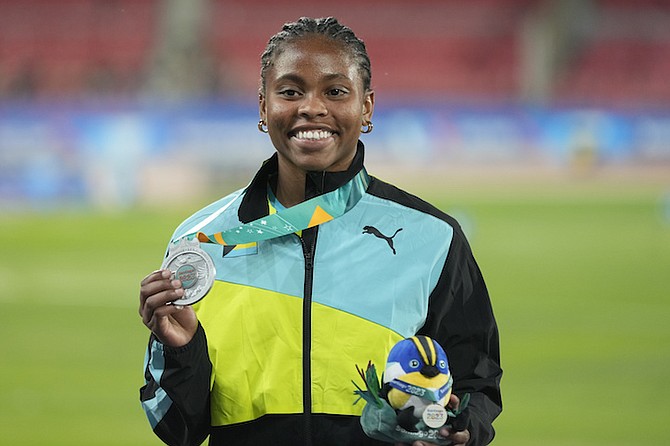 RHEMA OTABOR, of The Bahamas, poses with her silver medal on the podium during a ceremony for the women’s javelin category, at the Pan American Games in Santiago, Chile, on Friday, November 3, 2023.
(AP Photo/Moises Castillo)