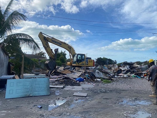 Demolition work taking place at the Kool Acres shanty town on Monday morning. Photo Moise Amisial