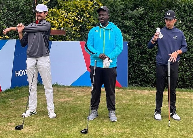 Richard Gibson Jr (centre) getting ready to tee off.