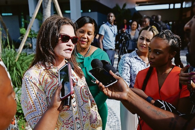 ATLANTIS’ president and managing director Audrey Oswell speaks with reporters at the opening of Kings College School, Monday.
Photo: Dante Carrer